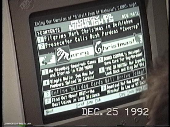 A vintage computer screen displays a text interface with a list of contents, including topics related to Christmas and news from December 25, 1992. The header reads "Today’s Highlights," featuring titles such as "Pilgrims Mark Christmas in Bethlehem

 (online service), pictures by Benj Edwards.

https://www.vintagecomputing.com/index.php/archives/932