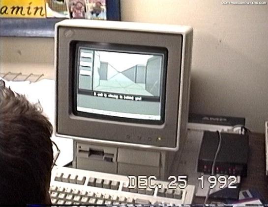 A vintage computer setup from December 25, 1992, featuring a CRT monitor displaying a 3D graphic or game environment. A person’s head is partially visible in the foreground, looking at the screen. 

 (online service), pictures by Benj Edwards.

https://www.vintagecomputing.com/index.php/archives/932
