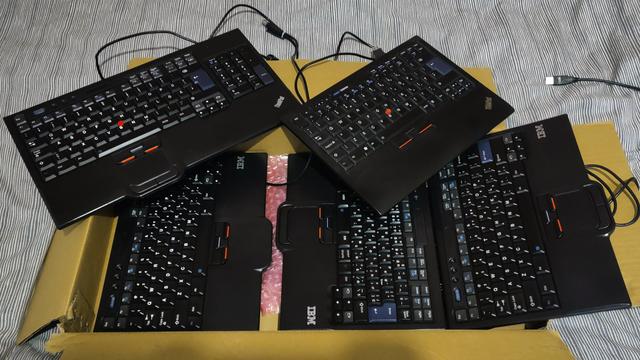 A photo of IBM/Lenovo SK-8835/8840/8845 keyboard variants (most) and a Lenovo SK-8855 keyboard (top-right).