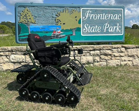The DNR is adding 10 more all-terrain electric track chairs at eight locations this month and in June, opening areas to visitors with limited mobility or those whose devices are difficult to use in the outdoors. 

From the article is a track chair photographed at Frontenac State Park near Red Wing in Minnesota.