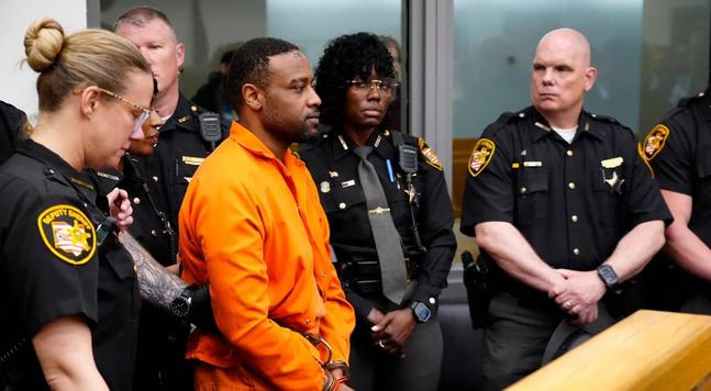 Rodney Hinton was guided through court exclusively by female officers at his first court appearance over the weekend.

Because, you know, they couldn't trust any of these kid killing male cops.