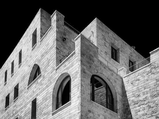 High contrast black and white architectural detail of a corner of the Sea Mosque in Old Jaffa, Tel Aviv Israel, taken in an upward-looking angle.