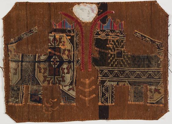 Woven and sewn textile with a bronze field depicting two abstract patterned feline animals with four legs and long tails, wearing colorful crowns.