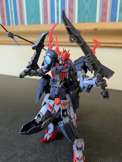 HG Barbataurus holding its short sword in each hand in a crouching combat pose