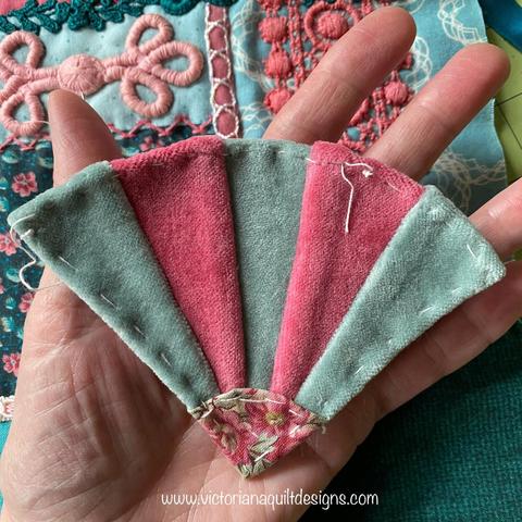 Small teal & rose velvet fabric fan.