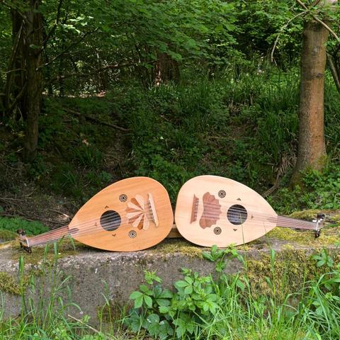 Two ouds I built, photographed in a forest.