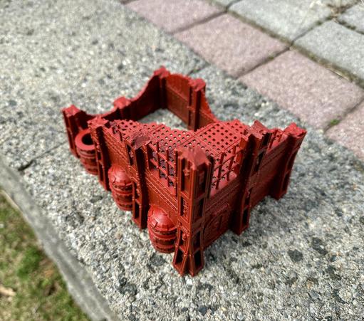 3D printed terrain piece for a small building matching Kill Team's Volkus terrain.