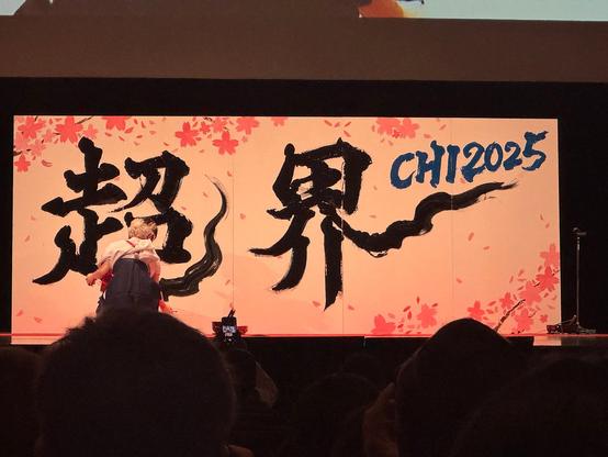 A large canvas showing Japanese calligraphy with the acronym CHI 2025.