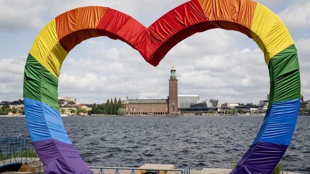 A heart in rainbow colors frames Stockholm City Hall during Pride Week on 31 July 2024. | © Christine Olsson, TT News Agency, Sweden Out, AFP