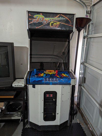 Picture of a Sega Dynamite Cop arcade cabinet sitting in the corner of my garage. 