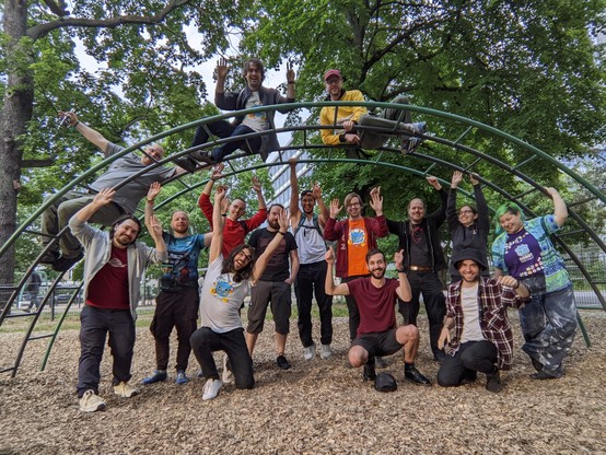 A final photo of the group, with raised hands still, and one brave soul now joining in on the fun and doing a "Look mum, no hands!" scaffolding stunt.