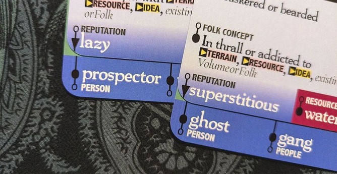 Downcrawl Deck cards showing the generated prompts "lazy prospector" and "superstitious ghost."