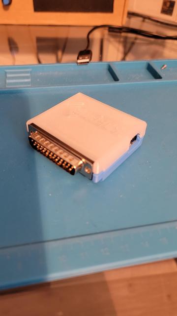 The final assembled external BlueSCSI in its case. The top half is white with BlueSCSI embedddd in it, and the bottom half is blue.