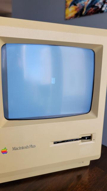 Picture of the Happy Mac booting for the first time ever on my Mac Plus.