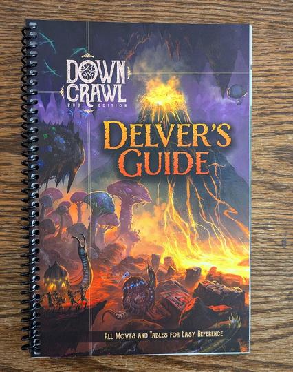 The Delver's Guide is a spiral-bound reference book for Downcrawl 2E containing every move and table in the game. Cover art by J.P. Targete.