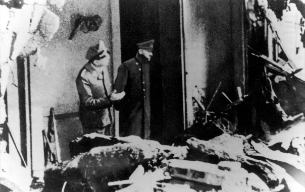 Last known photo of Adolf Hitler standing in the bombed out ruins of Berlin.