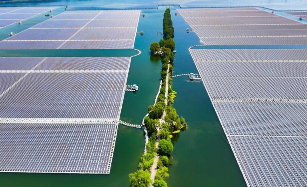 Floating solar panels stretch across an aquatic farm built on land that subsided after extensive coal mining, in Suixi County, Anhui province, China, on April 28, 2025.