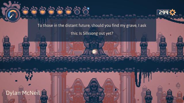 A screenshot from the game "Haiku, the Robot" showing the protagonist standing in the secret Catacombs area. Each of the graves there can be interacted with and display a short message by a backer of the game. This one reads: "To those in the distant future, should you find my grave, I ask this: Is Silksong out yet?"