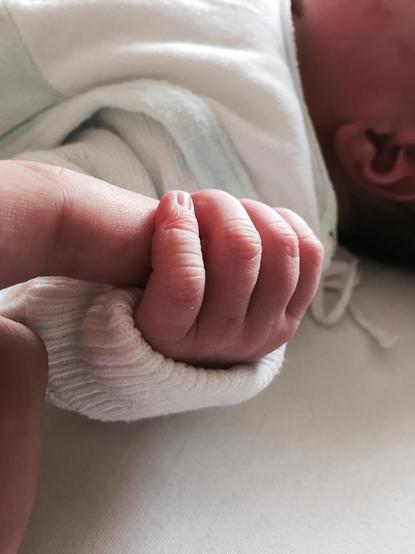 A tiny baby hand gripping my index finger (ten years ago on this day)