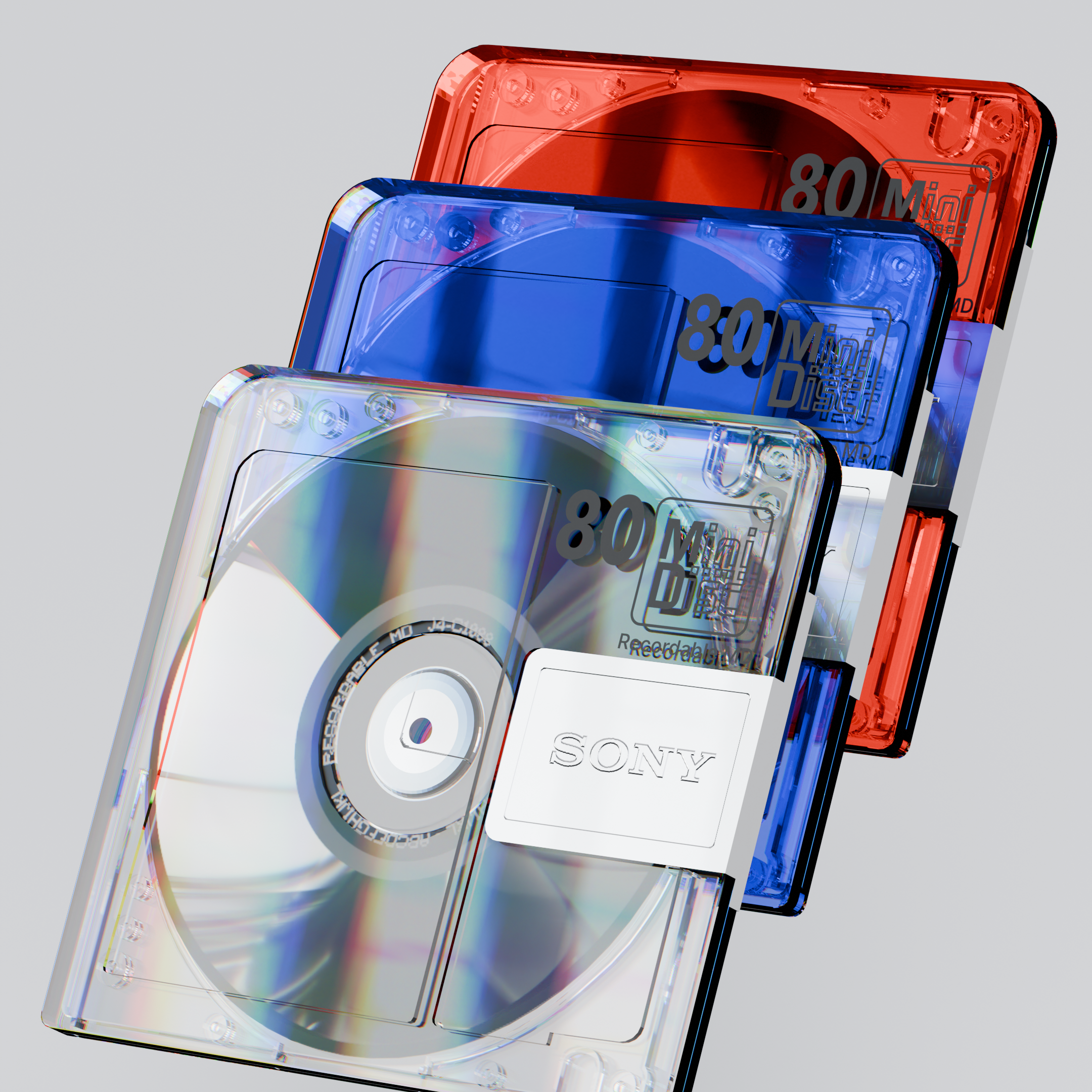 3D render of 3 Sony MD80 Mini Discs floating in space tilted three quarters and stacked at a vertical offset in different colors: clear, blue and red.