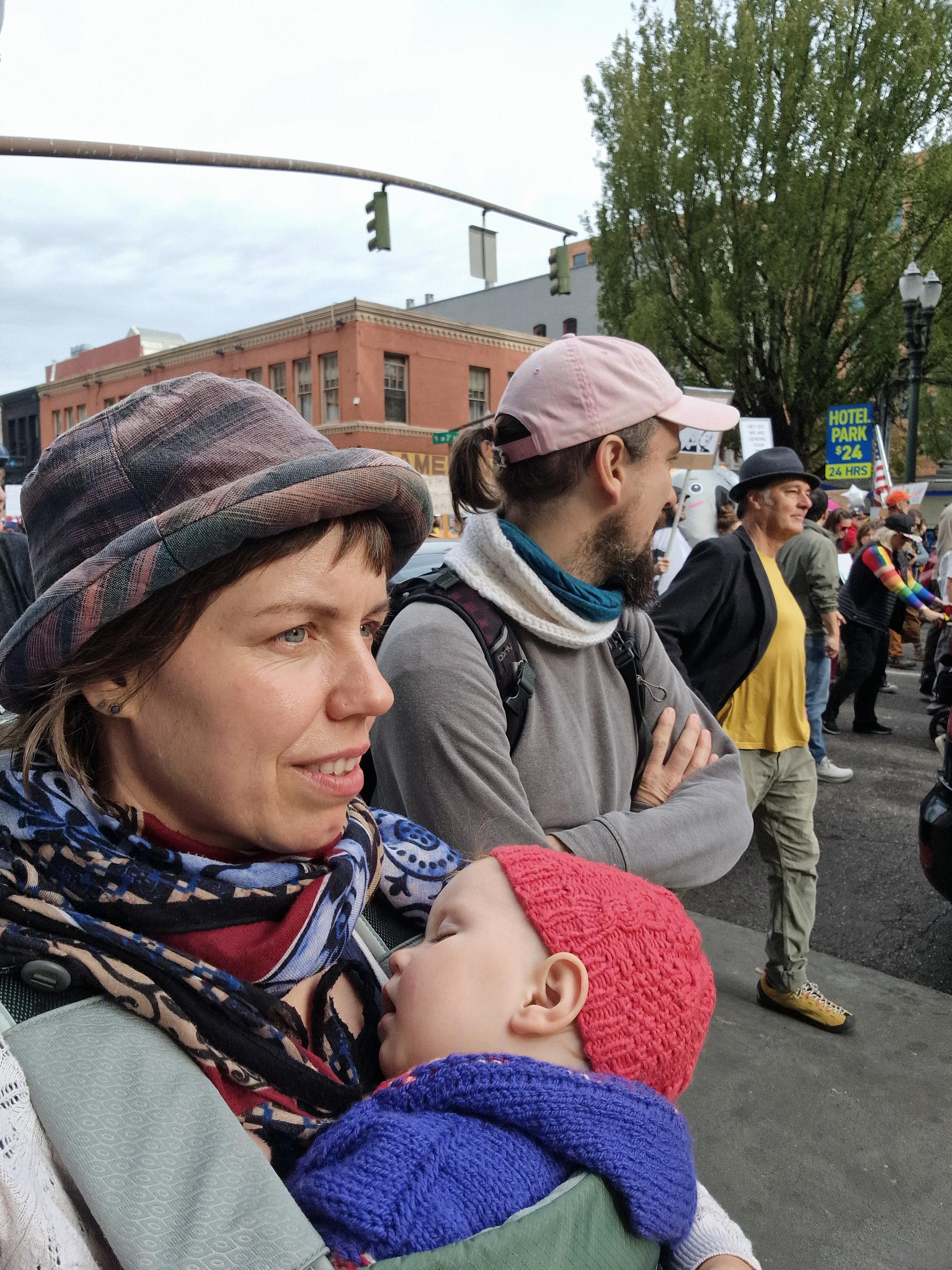 me and my part er and our little one in between the nokings march in portland/oregon