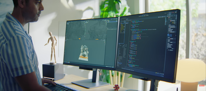 A screenshot from the new "Steam Hardware Announcement" video (at around 3:07 minutes) showing a dual monitor setup with Blender opened on the left and Godot on the right screen.