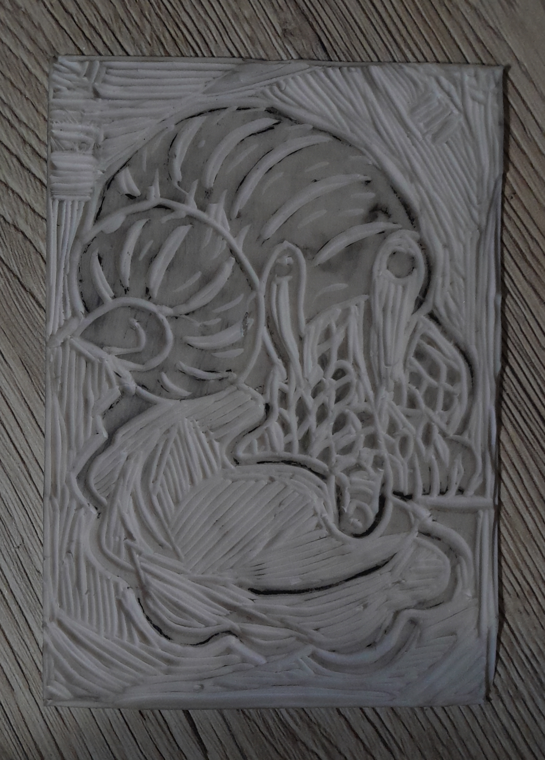 Linocut plate of Snail eating pieróg