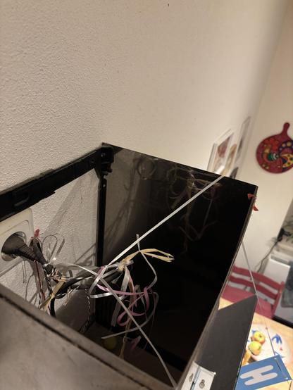 A wire with lots of birthday garland leftover ends of tape
