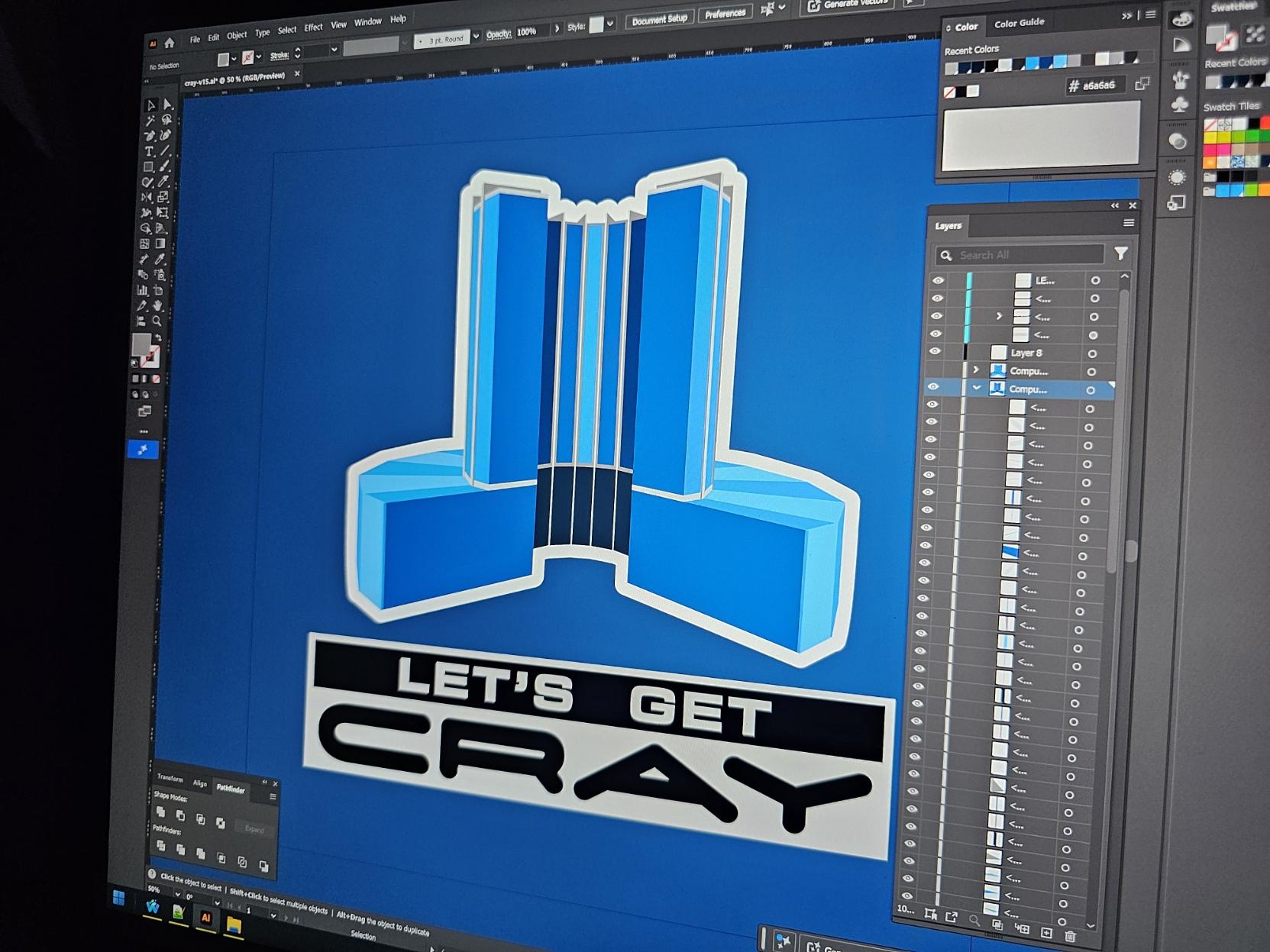 Photo of my screen with an Illustrator project open showing a blue vectorized version of a CRAY supercomputer with the caption "Let's get Cray"