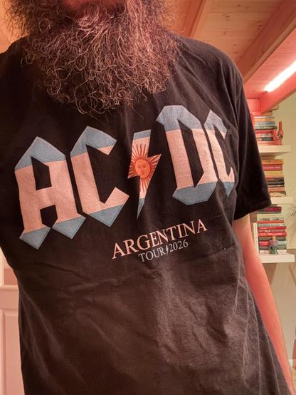 Me wearing a AC/DC shirt from the Power Up Tour 2026 in the Argentina edition. The Argentinian flag shines through the letter shapes of AC/DC