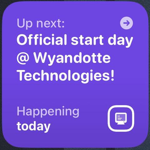 A purple notification card with white text reads: “Up next: Official start day @ Wyandotte Technologies! Happening today.” There is a small arrow icon in the top right corner and a computer screen icon in the bottom right corner.