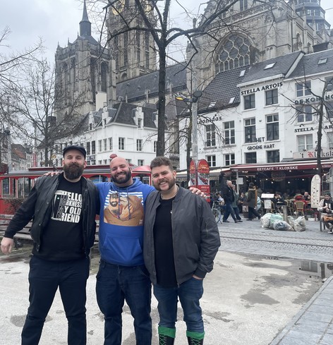 Three men standing in front of the cathedral of Antwerp, Belgium. I am in the middle, with @Vortex to the left and @hypnocub to the right. All three of us are wearing street clothes.