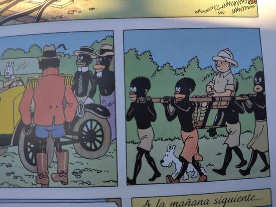 Tintin llevado en hombros por cuatro hombres