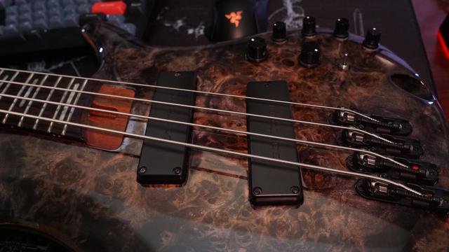 A picture of the face of the Ibanez SRMS800 fanned-fret bass guitar.  The stock "Bartolini" pickups are replaced with actual Bartolini MK4CBC pickups which have "Bartolini" on their faces.