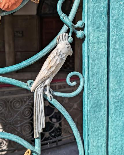 Trinkkuranlage, small parrot detail in iron work