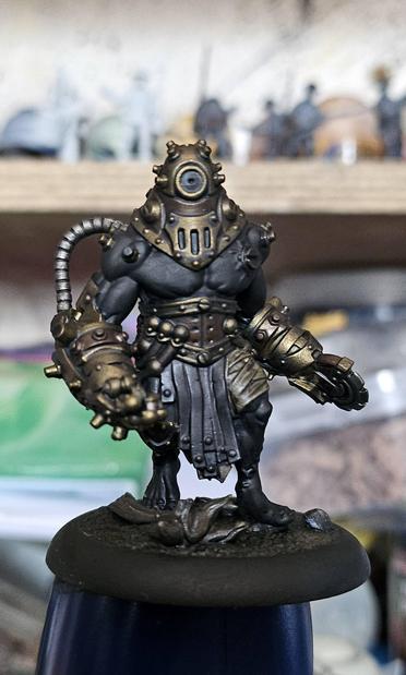 A miniature from the Cephalyx Criterion unit for Warmachine, with the Bronze brass, leather, base and bandages just base coated and shaded with a grime wash, the rest of the mini left black.