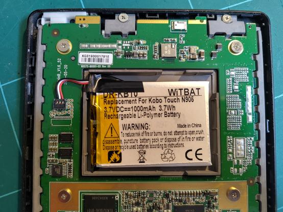Inside back of a Kobo touch ereader, with the new battery installed.