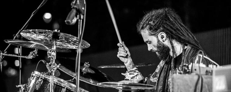A black and white picture of me playing drums in a live show