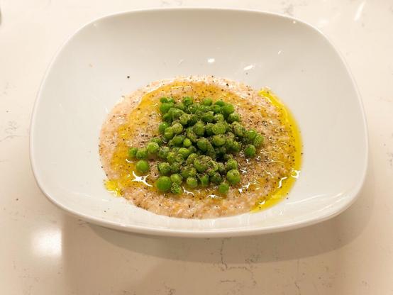 Savory Oatmeal with Peas, Parmesan, and Pepper inspired by Andrea Geary from Cook’s Illustrated, Jan./Feb. 2023.