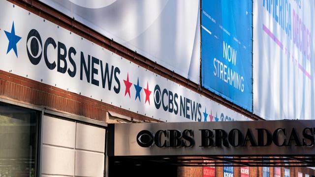 Large CBS News signs on the outside of the company's broadcast center.