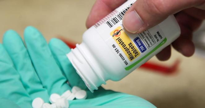 A pharmacist poses with pills of Misoprostol, made by Lupin Pharmaceuticals, at a pharmacy in Provo, Utah, on June 19, 2019.