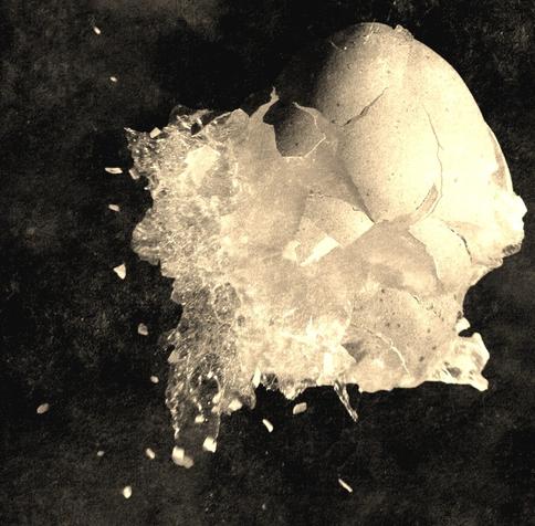An explosion in white with a cloud like form next to it. An explosion in white with a cloud like form next to it.