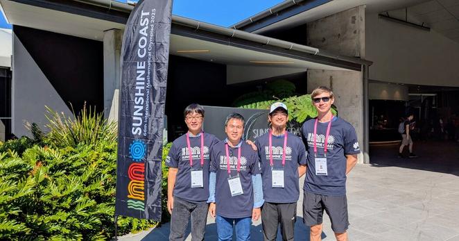Google DeepMind representatives at the International Mathematical Olympiad on Australia’s Sunshine Coast. From left, Junehyuk Jung, Thang Luong, Dawsen Hwang and Yuri Chervonyi. 