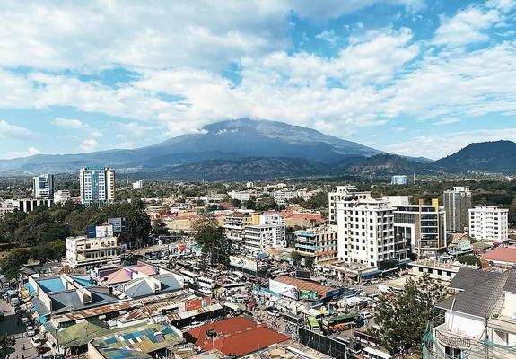 Arusha city view with Mount Meru in the background, taken from a hotel balcony