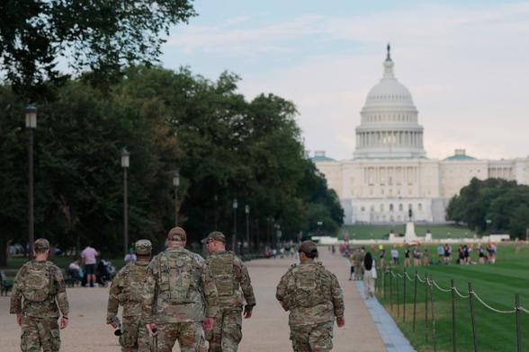 Members of the National Guard walk on the National Mall on August 14, 2025 in Washington, D.C.