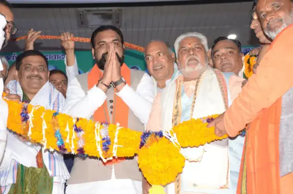Bihar's Deputy Chief Minister Samrat Choudhary being greeted by party members while inspecting preparations for PM Modi's visit to state.