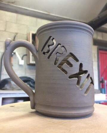 A mug with the word "brexit" carved out. So, a useless mug!