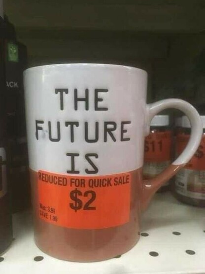 Mug with text that reads "the future is". The last part is obscured by a sale sticker reading "reduced for quick sale $2".