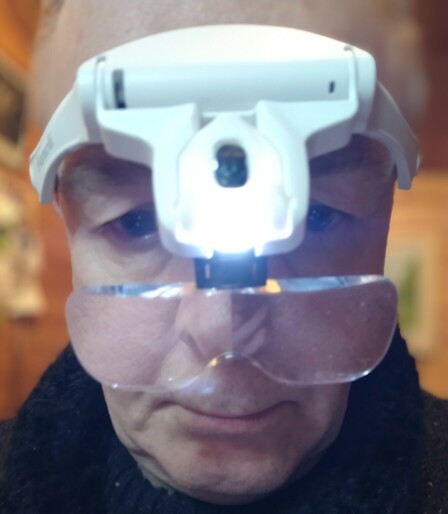Wearing a magnifying headset... I do NOT look like a plonker.