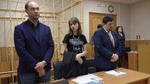 Olesya in Court. She is only allowed to leave home to attend court